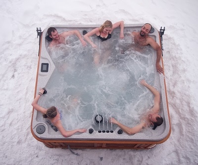 Top view of a hot tub in winter with 6 person inside