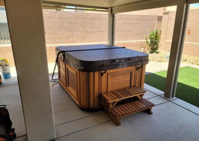 covered hot tub arctic spas in red cedar cabinet